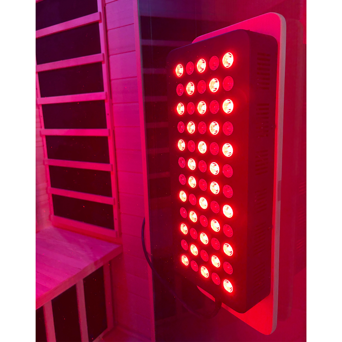 Blisspod Malmo sauna, close-up of the front red light panel on use