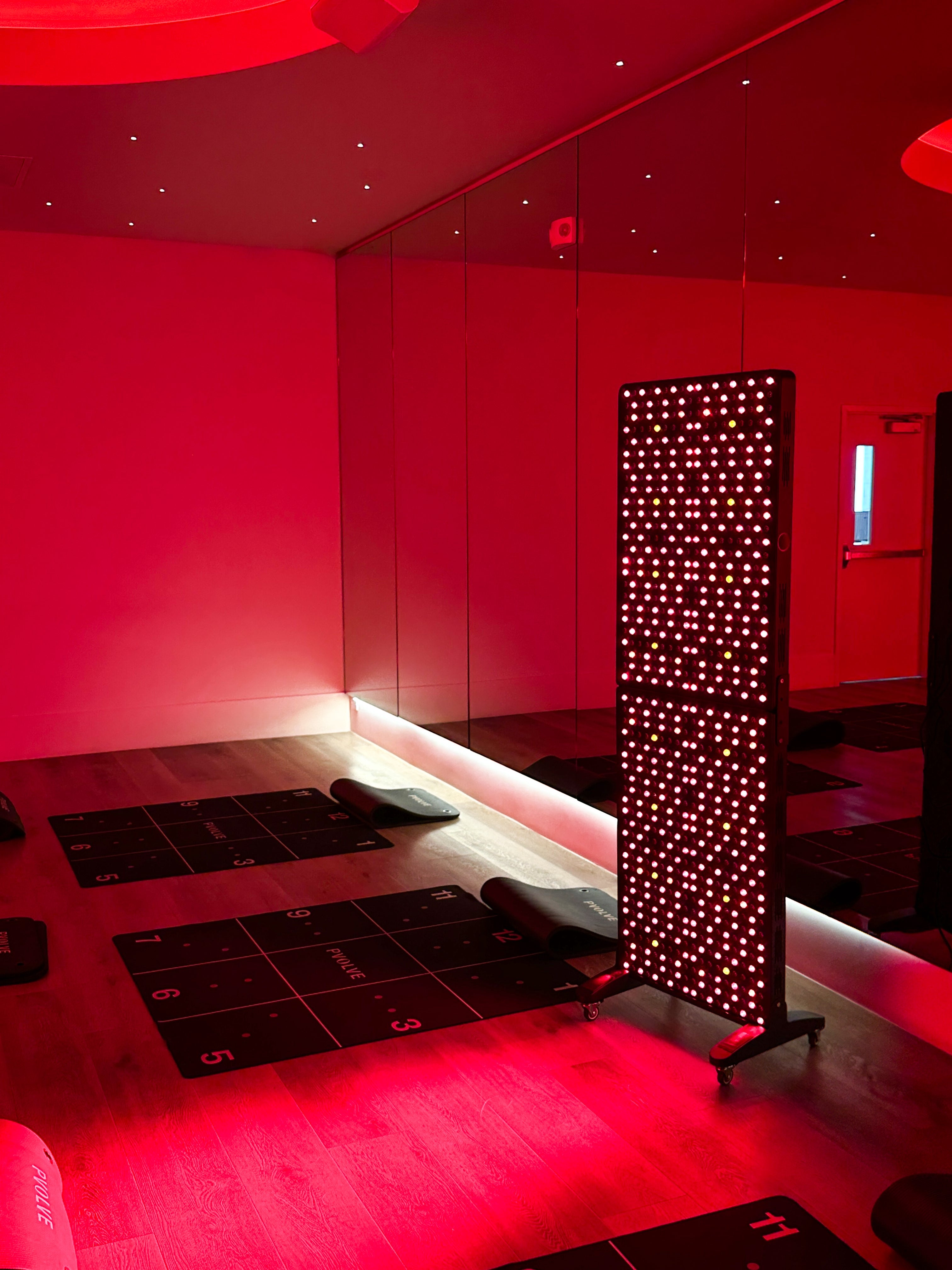 Renew Max red light panel shown in a fitness studio setting
