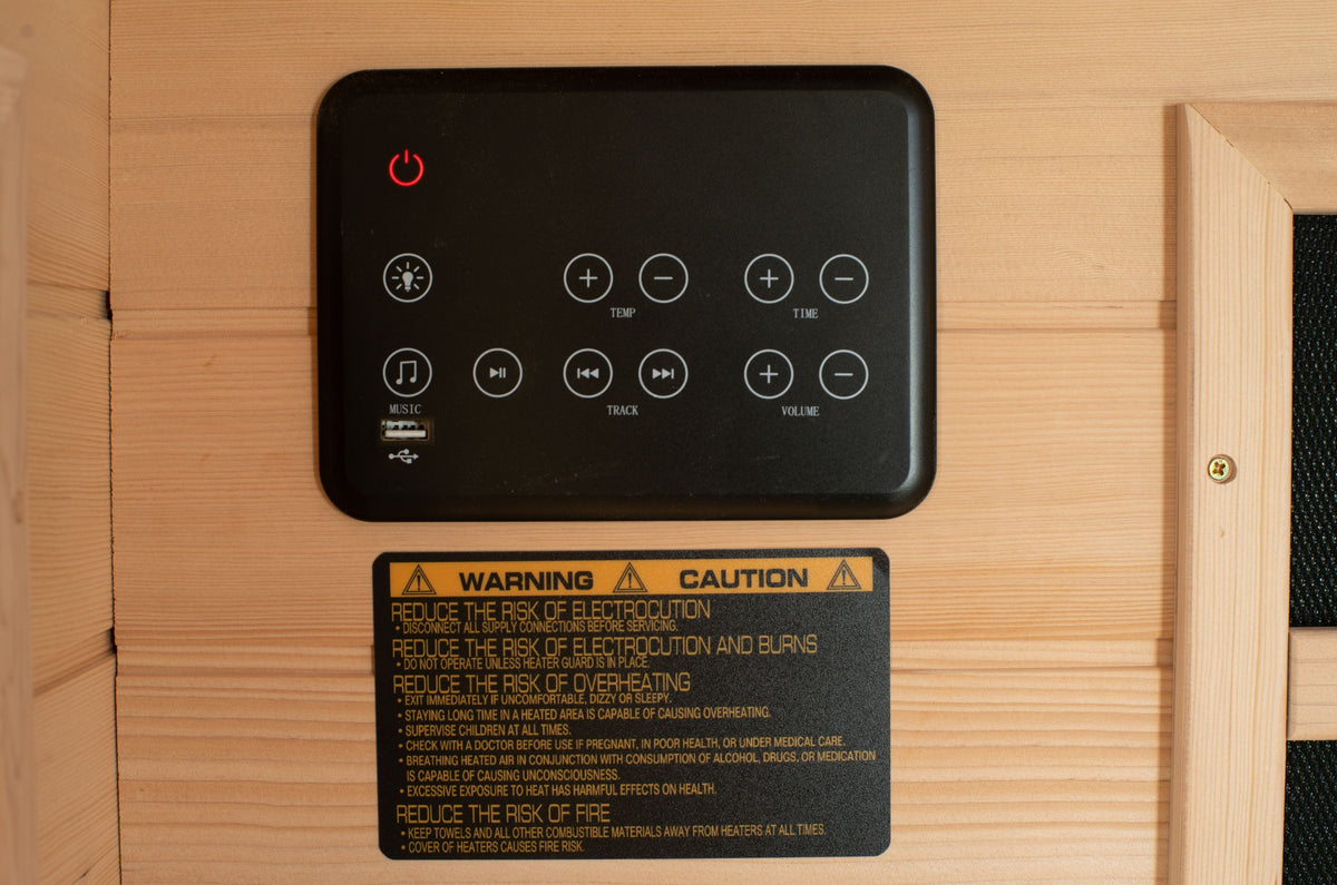 Blisspod Vienna corner far infrared sauna, control panel with buttons and warning label on a wooden surface