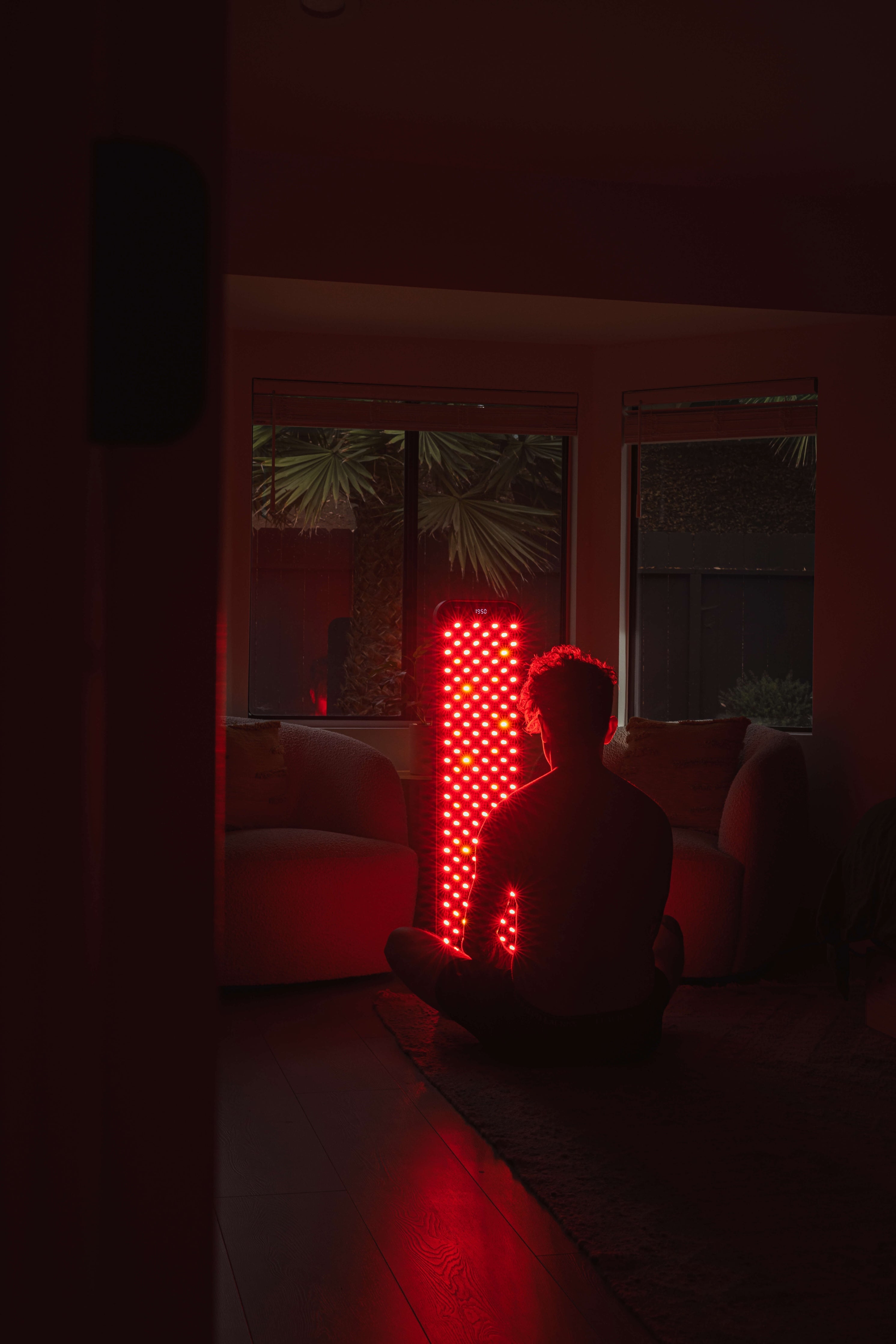 Renew Large red light therapy panel on its floor stand shown in use